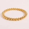 Detailaufnahme des polierten, 18 Karat vergoldeten elastischen Perlenarmbands mit Glanz - 6mm / Gold