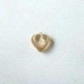 Detailed view of heart-shaped gold earring with textured radial patterns and clear center - Heart Striped Style (4710493690778) / Amber Gold