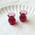 Macro shot of two miniature fuchsia glass vases with fluted texture and wavy rims - 1 Piece / Dark Purple