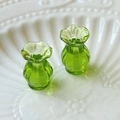 Macro shot of two green transparent glass miniature vases with ruffled edges for dollhouses - 1 Piece / Green