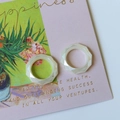 Set of two ivory white geometric resin rings displayed on a vintage floral card - Faceted Hollow Ring (Artificial Pearl)