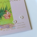 Close-up of elegant small wreath-shaped earrings made of polished white faux pearls - Small Hollow Ring (Artificial Pearl) / 10 Pieces Pack
