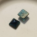 Detailed macro view of square resin charms with deep blue and gold silk textures - 20mm Square Navy