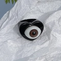 Gothic punk style black heart ring featuring a realistic brown eyeball resin center - Black