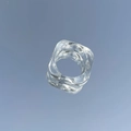 Macro shot of transparent resin ring featuring irregular wave square geometry design - Clear White