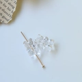 Detailed macro view of transparent acrylic bear beads for DIY jewelry with metal pins - Clear White