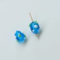 Macro view of blue glass beads with white dots and green leaf accents for DIY jewelry - Strawberry Style (31#) / 1 Piece / Blue