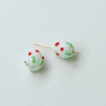 Detailed view of white glass beads with red dots and green vine texture for DIY jewelry - Strawberry Style (32#) / 1 Piece / White