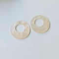 Detailed view of round iridescent resin pendants with pearlescent marble texture - Chrysanthemum Pink