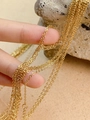 Vue détaillée d'une chaîne en acier inoxydable doré pour création de bijoux - Chaîne à Croix Dorée
