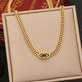 Collier œil maléfique doré en titane avec pierre bleue et chaîne tissée épaisse - X892 Collier Œil Noir Or