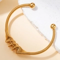 Brazalete de resorte de acero inoxidable chapado en oro de 18K con terminales de esfera - Ritmo #1 / Dorado
