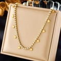 Gold eight-pointed star necklace with full zircon pavé crystals on jewelry box - Gold Star Pendant Tennis Chain (N2483)