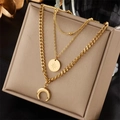 Three-layer gold-plated stainless steel necklace with moon and starburst pendants - Sun Star Moon Layered (N1705)