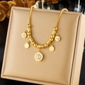 Polished gold roman numeral necklace with zircon tassel displayed on a jewelry stand - Snake Roman Numeral Crystal (N1821)