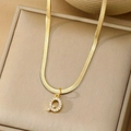 Gold flat snake chain necklace with a zircon paved letter Q pendant on jewelry box - Letter Q