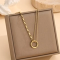 Asymmetrical gold tone titanium steel necklace featuring a smooth circle pendant - Circle Spliced Necklace (X822) / Gold
