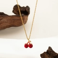 Elegant gold titanium steel necklace with red cherry pendant and sparkling rhinestones - Cherry Necklace Gold
