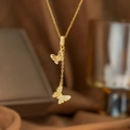 Elegante goldene Schmetterlingskette mit Zirkonsteinen an einer feinen Gliederkette - Schmetterling Quaste Stil (9261)