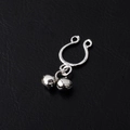 Polished silver non-pierced nipple ring with double bells on a black leather background - Silver