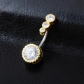 Macro shot of gold navel ring with sparkling cubic zirconia on black leather background - Gold
