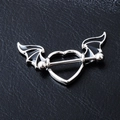 Gothic heart barbell nipple ring with black bat wings on textured leather backdrop - Heart Bat Wing Style (Image Color)