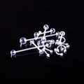Clear acrylic body piercing set including barbells and rings on a black background - Clear