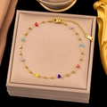 Detailed close-up of golden titanium necklace featuring colorful mini stones and lobster clasp - Bracelet / Gold Colorful Crystal Cube Bracelet