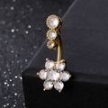 Golden belly button ring with zircon floral design and dangling crystals on a black stand - 6-Petal Flower Gold