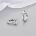 Macro shot of silver floral hoop earrings with sparkling cubic zirconia stones and S925 finish - Platinum White Zirconia