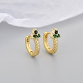 Macro detail of gold hoop earrings with green stones and sparkling white zircons - Gold Green Zirconia