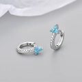 Macro shot of silver huggie earrings with turquoise flower cluster and zircon pavé - Platinum Tone Turquoise