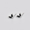 Macro view of butterfly wing earrings with marquise-cut black stones in silver setting - White Gold Black Rhinestone