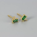 Macro shot of rectangular emerald green zircon stud earrings with gold plating finish - Green Stone Round Gold