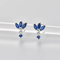 Macro shot of silver stud earrings with marquise dark blue stones on acrylic display stand - Silver/Blue
