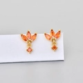 Detail view of gold stud earrings with marquise-cut orange zirconias in floral design - Gold Orange