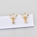 Macro detail of gold marquise cut stud earrings featuring sparkling cubic zirconia stones - Gold/White
