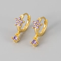 Close-up of golden S925 silver hoop earrings with purple flower and square gemstone - Gold/Purple