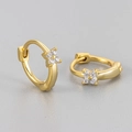 Macro detail of gold-plated clover huggie earrings featuring sparkling zircon inlay - Four-leaf Zirconia Style / Small / Gold