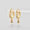 Detail of 18K gold hoop earrings with star engravings and a purple zircon rectangle charm - Gold/Purple Zirconia