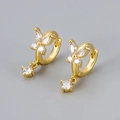 Close-up of golden butterfly earrings with sparkling zircon wings and crystal drop charms - Gold/White Zirconia
