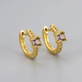 Macro detail of gold S925 silver hoop earrings with square purple zircon and small white diamonds - Gold/Purple Zirconia
