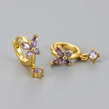 Detail of gold butterfly hoop earrings featuring purple zircon stones and drop pendant - Gold/Purple Zirconia