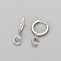 Close-up of S925 silver hoop earrings with letter C pendant and cubic zirconia - Silver / C