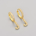 Detail of gold letter J hoop earrings featuring pave-set white cubic zirconia stones - Gold / J
