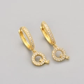 Close-up of gold letter Q hoop earring with white pave-set cubic zirconia stones - Gold / Q