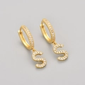 Close-up of golden letter S earring with white cubic zirconia pavé setting detail - Gold / S