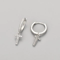 Macro detail of silver letter T drop earring with pave set crystals on a neutral background - Silver / T