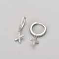 Detailed view of silver hoop earrings with shimmering X-shaped micro-pave charms - Silver / X