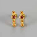 Detail of gold screw-back studs with four orange vertical zircons in claw setting - Gold Orange Zirconia